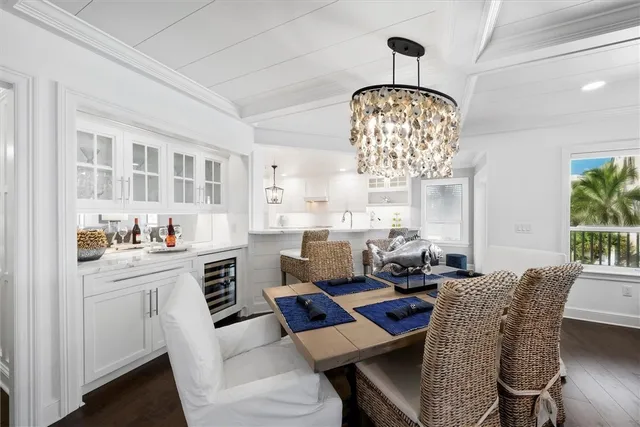 a living room with furniture and chandelier