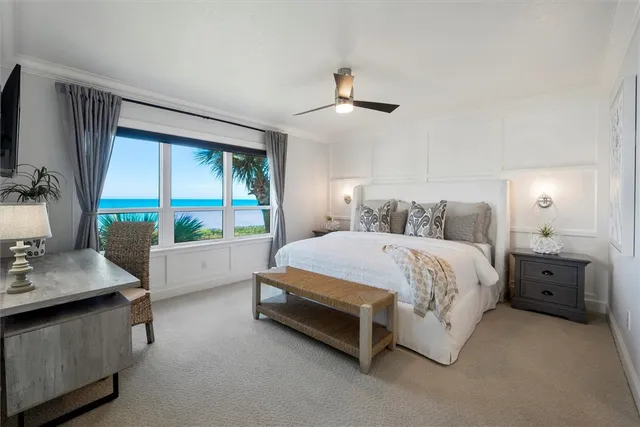 a spacious bedroom with a bed and a desk