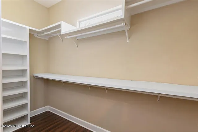 a view of an empty walk in closet