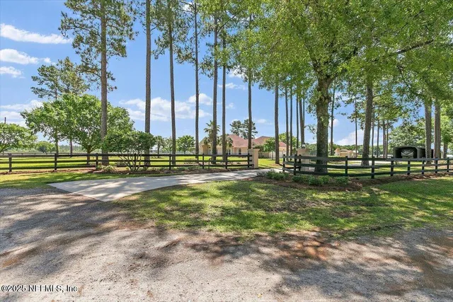 a view of swimming pool with a back yard