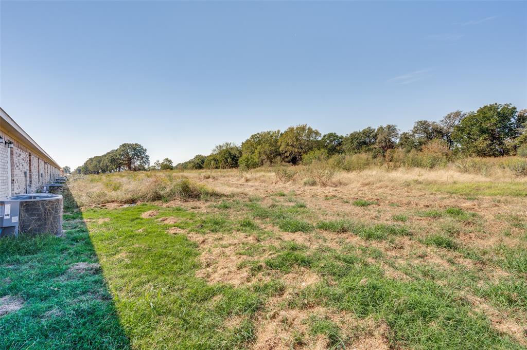 19148 Cabo Way, Unit 19160 Thackerville, OK 73459 - Photo 19 of 19 a view of a yard with a mountain