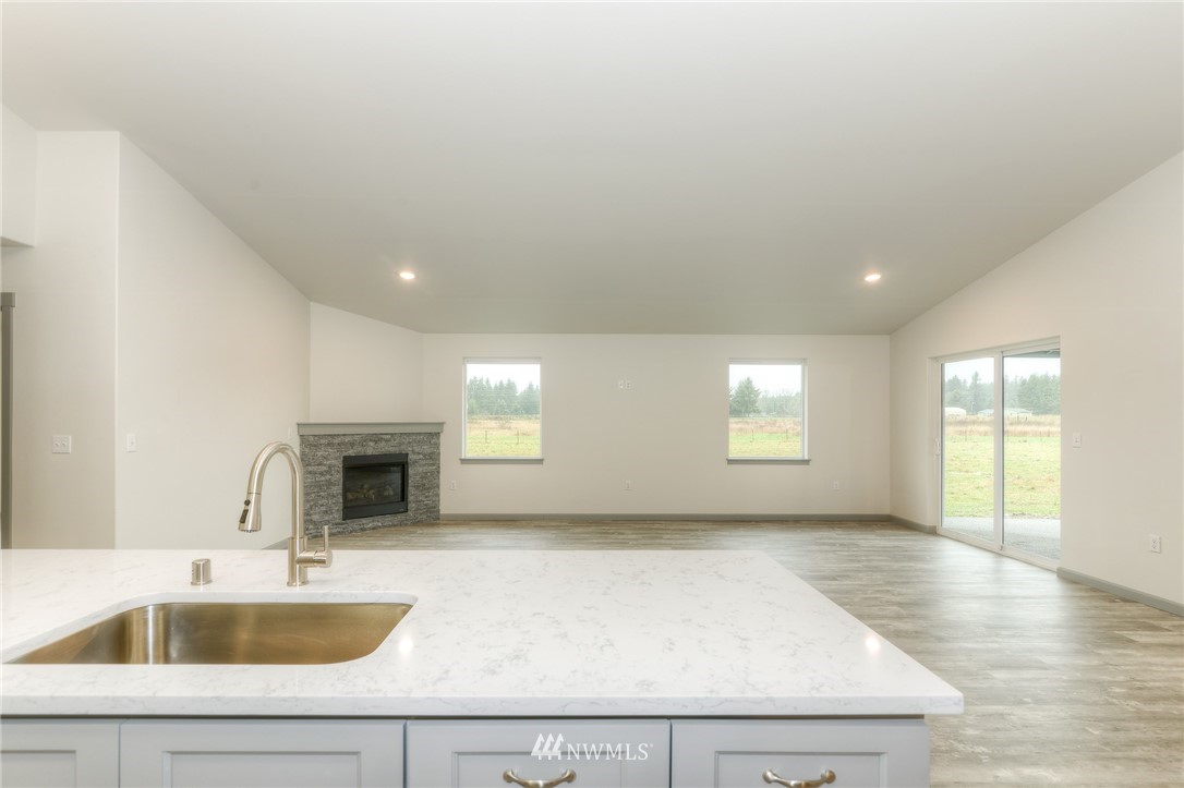 18430 Guava Street Southwest Rochester, WA 98579 - Photo 12 of 36 a kitchen with sink and window