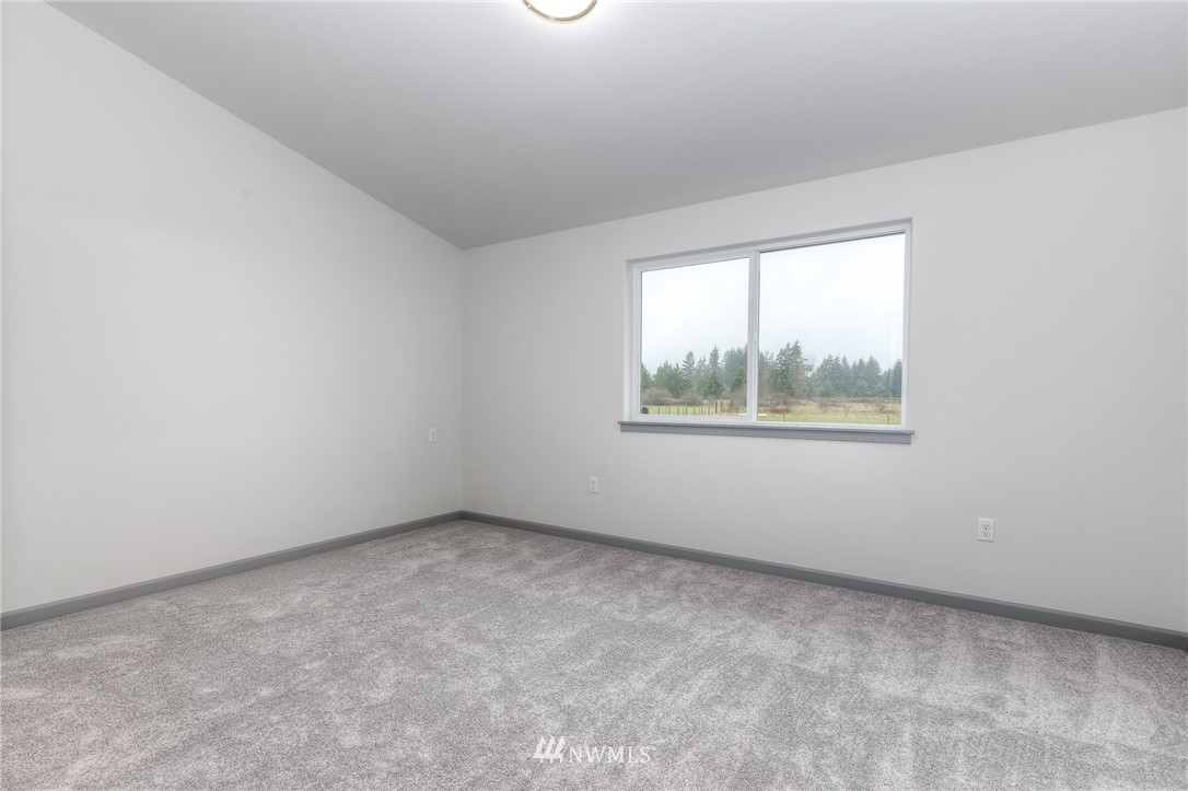 18430 Guava Street Southwest Rochester, WA 98579 - Photo 19 of 36 an empty room with windows