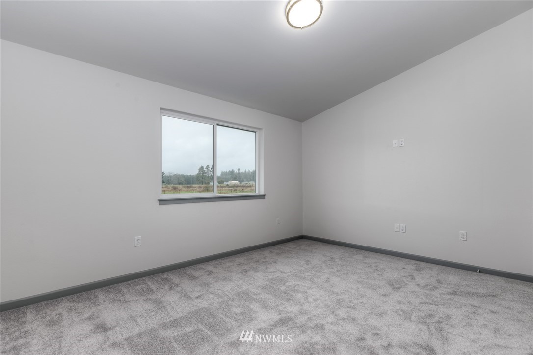 18430 Guava Street Southwest Rochester, WA 98579 - Photo 21 of 36 an empty room with windows