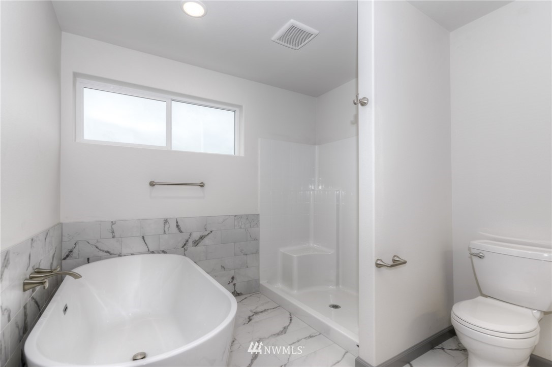 18430 Guava Street Southwest Rochester, WA 98579 - Photo 23 of 36 a bathroom with a sink and toilet