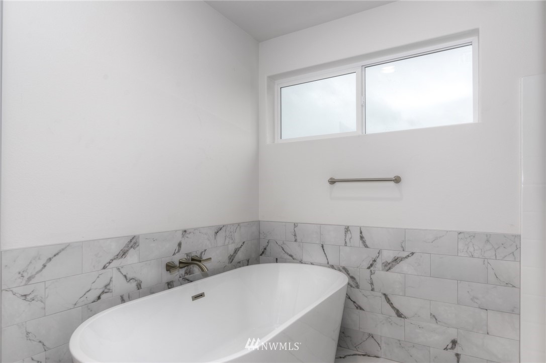 18430 Guava Street Southwest Rochester, WA 98579 - Photo 24 of 36 a view of a bathtub in a bathroom