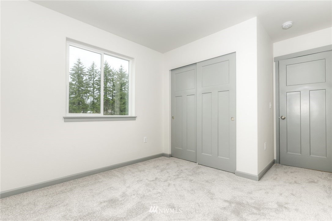 18430 Guava Street Southwest Rochester, WA 98579 - Photo 28 of 36 an empty room with windows and closet