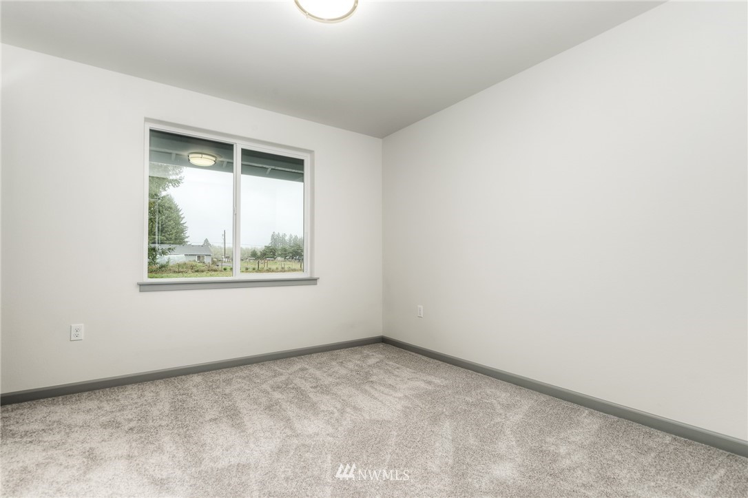 18430 Guava Street Southwest Rochester, WA 98579 - Photo 29 of 36 an empty room with a window