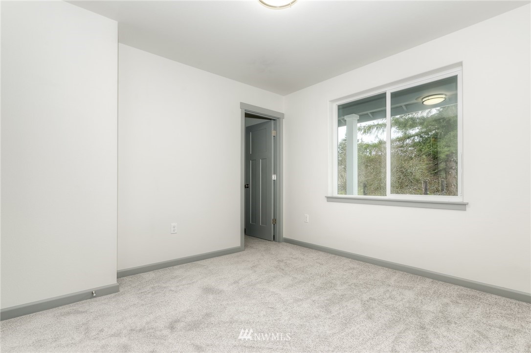 18430 Guava Street Southwest Rochester, WA 98579 - Photo 30 of 36 an empty room with a window