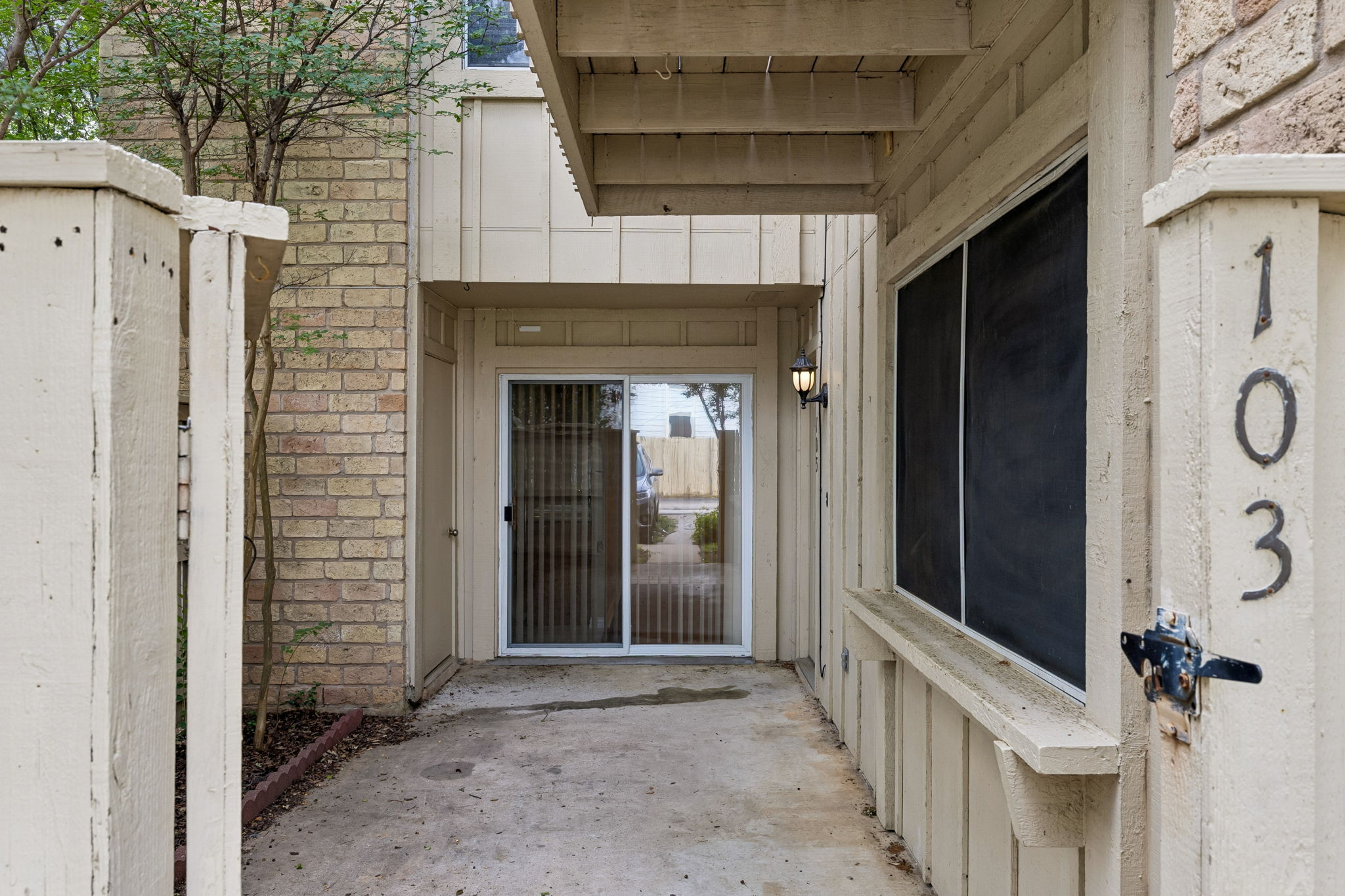 8340 Fathom Circle, Unit 103 Austin, TX 78750 - Photo 2 of 30 a view of a front door and wooden door