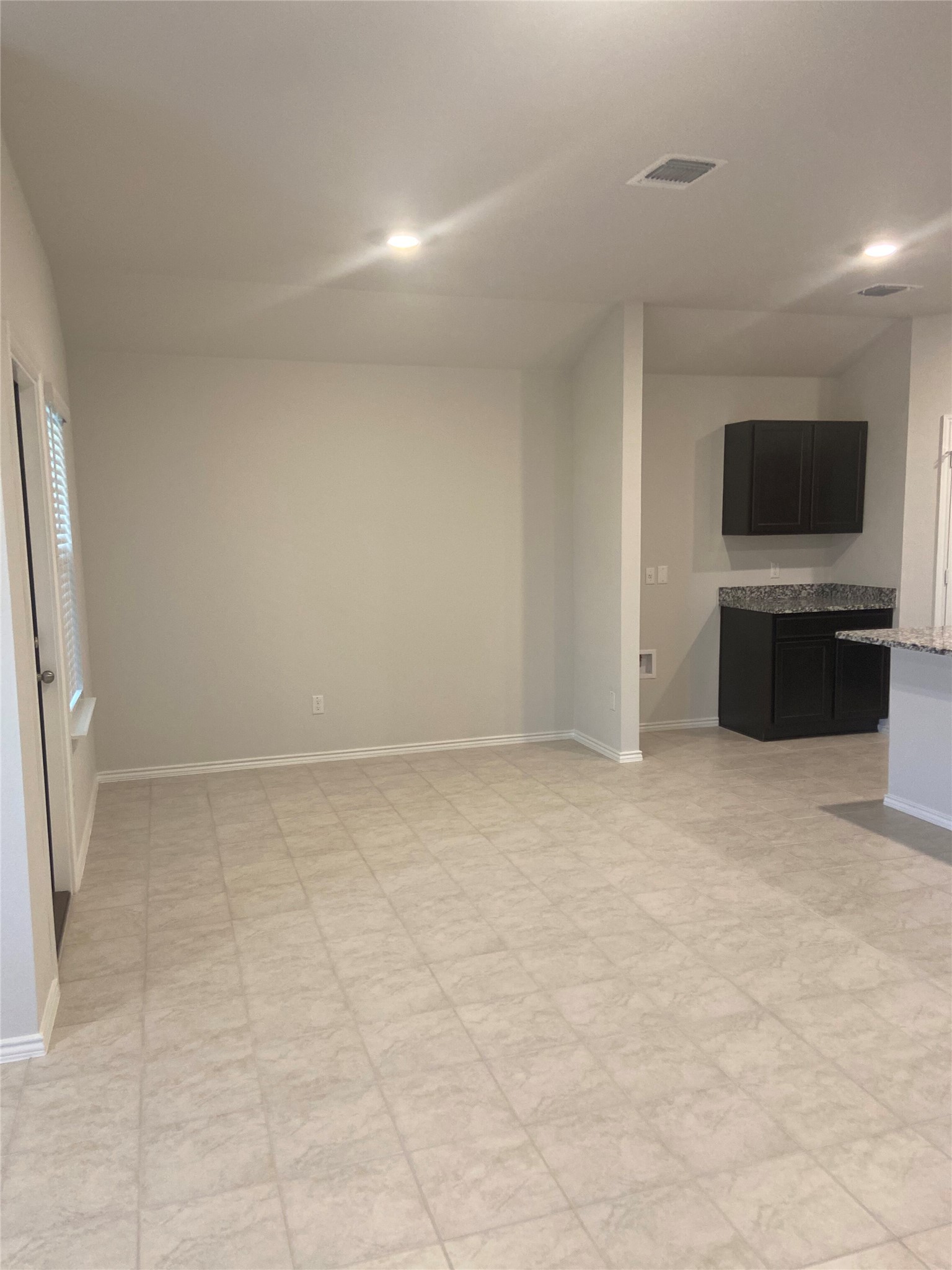 516 Taggart Trail Jarrell, TX 76537 - Photo 3 of 10 A well-proportioned interior space showcasing tiled flooring and recessed lighting.