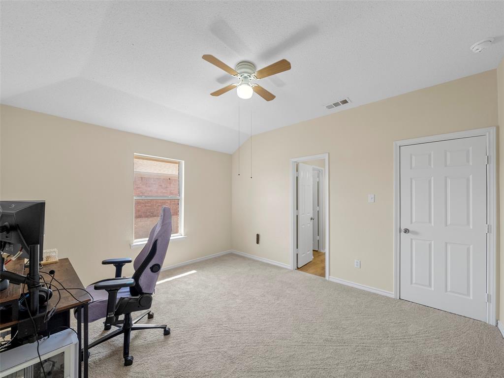 741 Aspen Court Allen, TX 75002 - Photo 32 of 40 Upper back bedroom, featuring fresh paint, carpet and ceiling fan