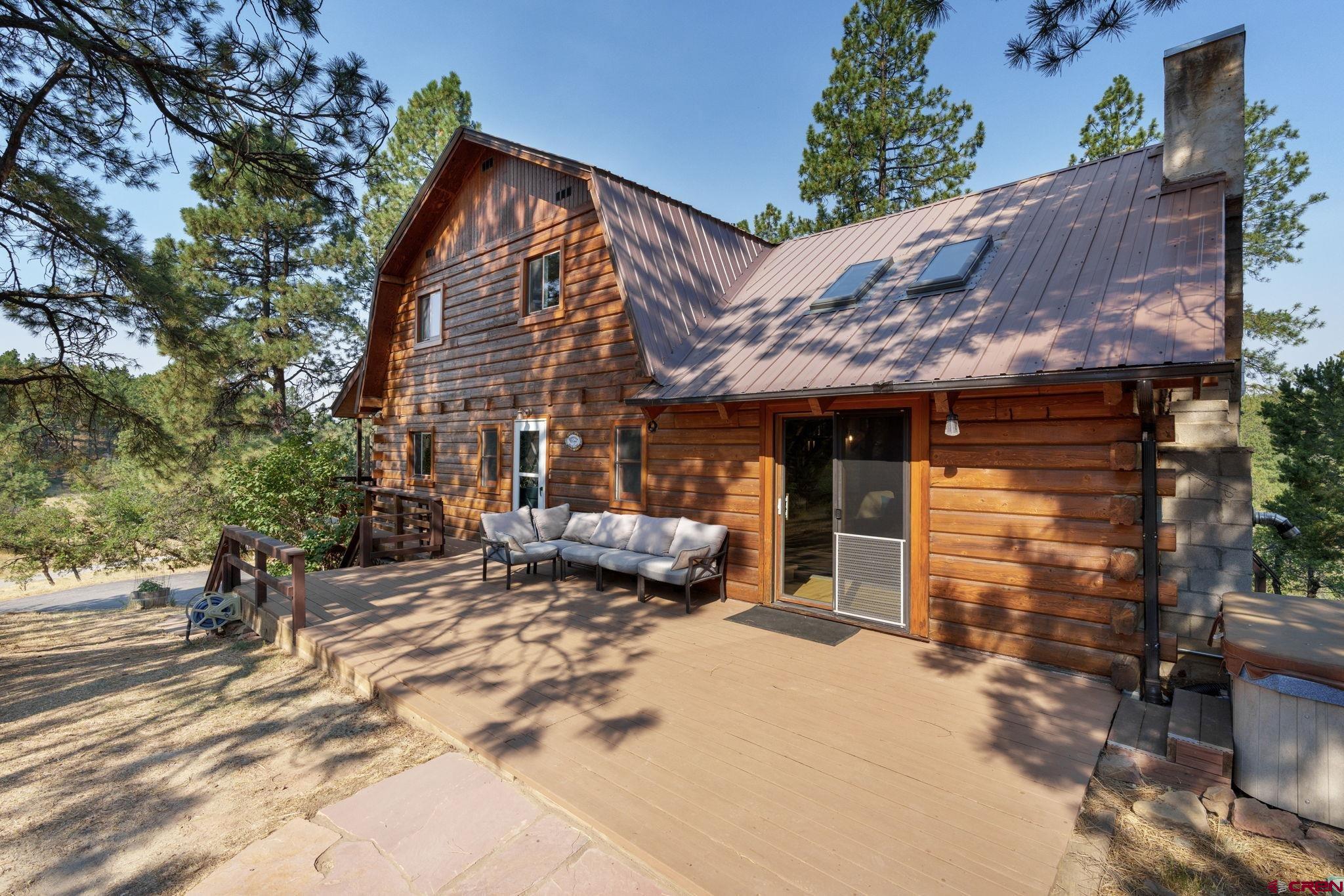 1310 Meadow Road Durango, CO 81303 - Photo 14 of 45 a view of a house with a patio