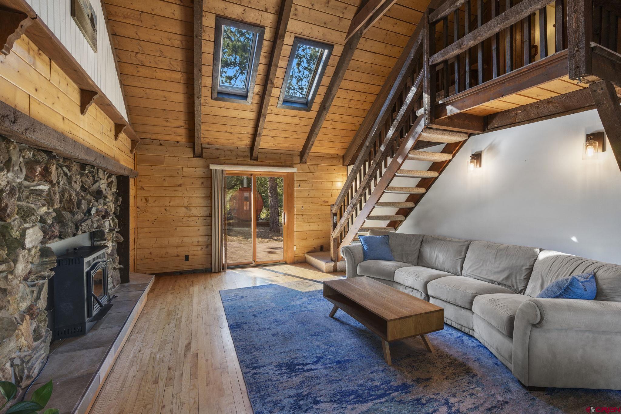 1310 Meadow Road Durango, CO 81303 - Photo 17 of 45 a living room with furniture and a fireplace