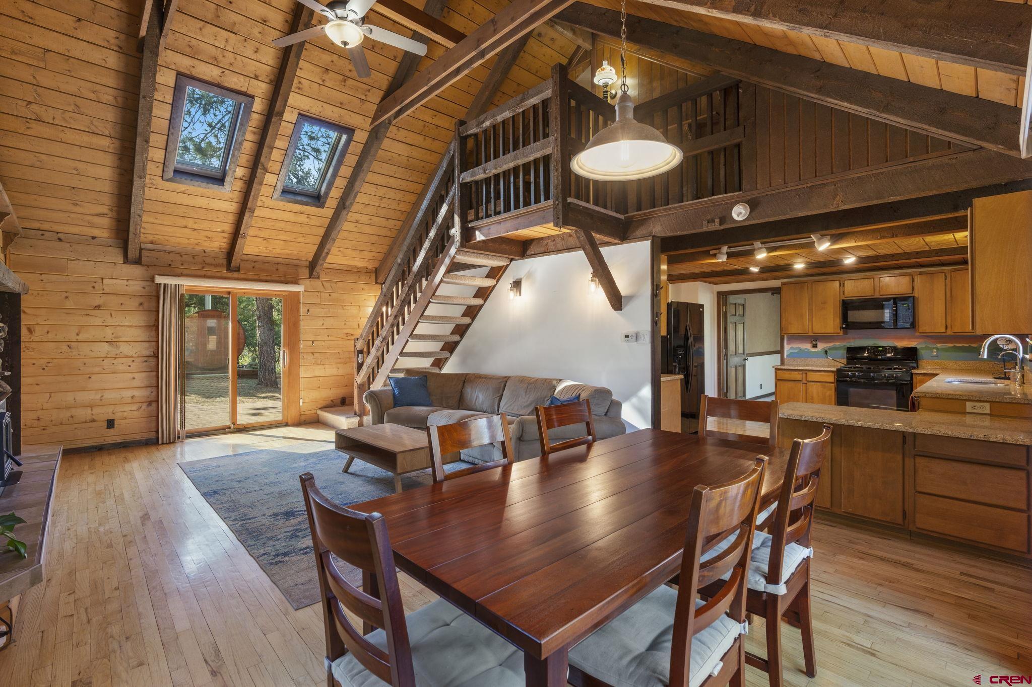 1310 Meadow Road Durango, CO 81303 - Photo 19 of 45 a view of a dining room with furniture and wooden floor