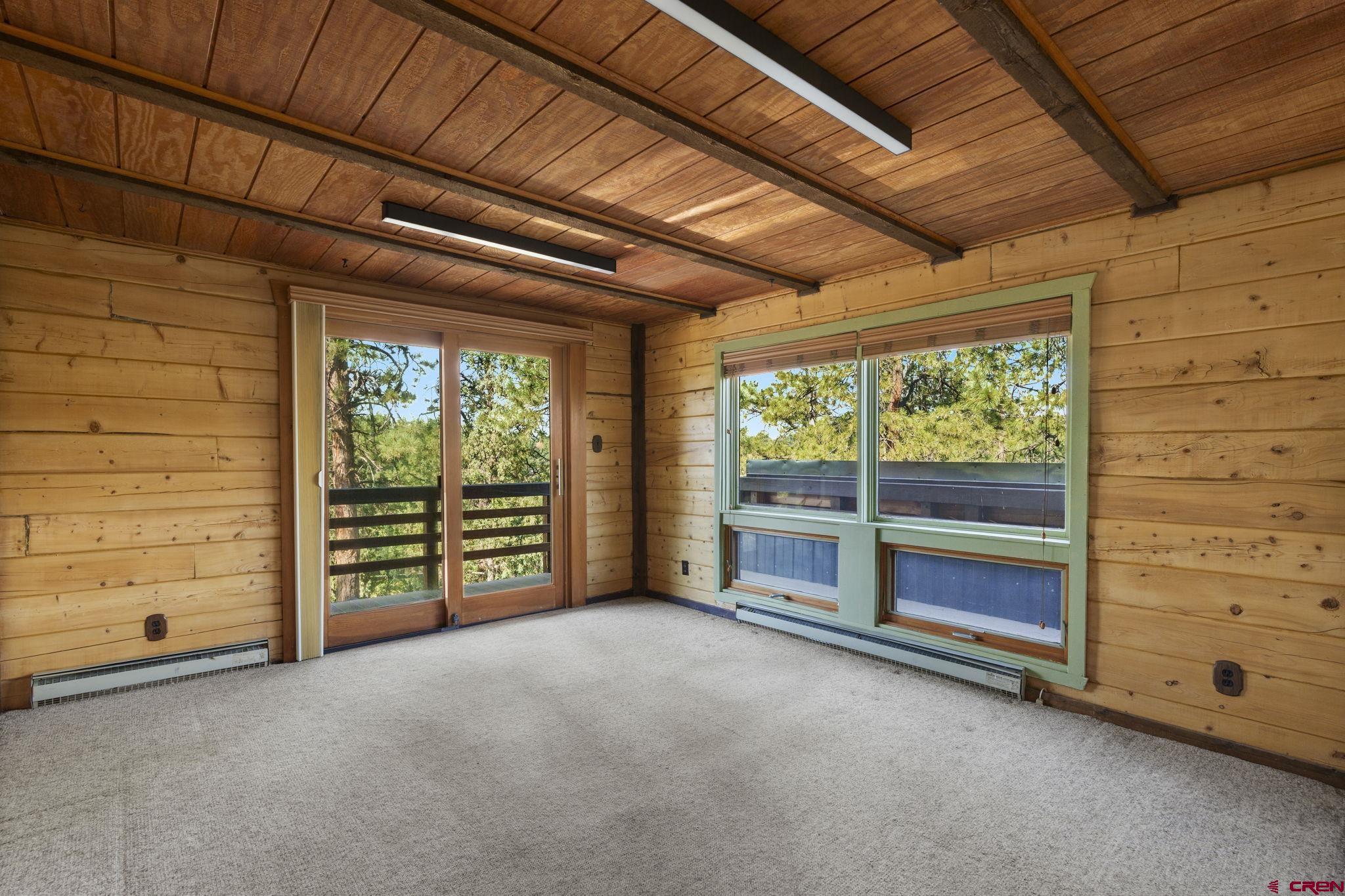 1310 Meadow Road Durango, CO 81303 - Photo 23 of 45 a view of an empty room with a balcony