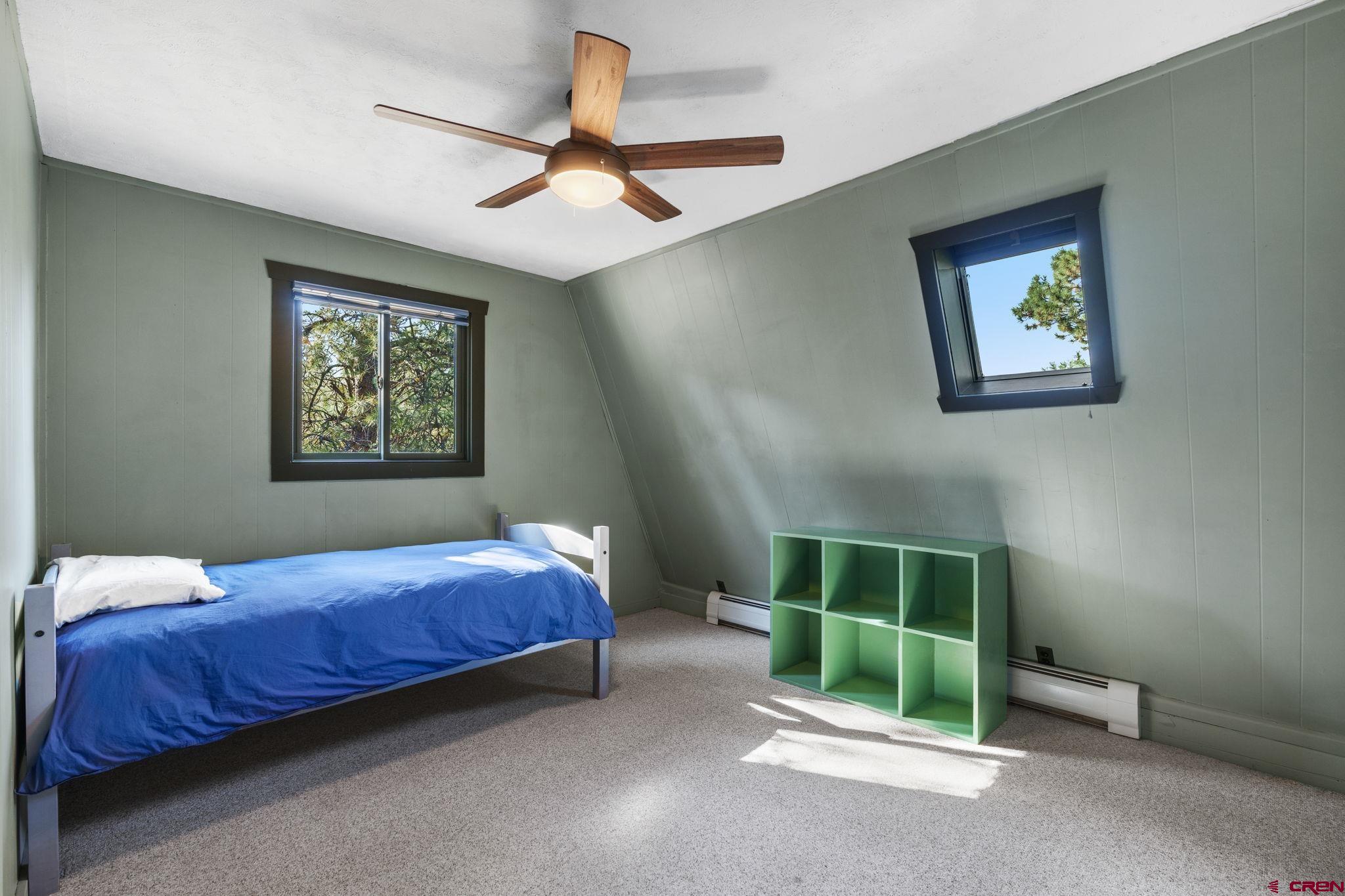 1310 Meadow Road Durango, CO 81303 - Photo 27 of 45 a bedroom with a bed and a window