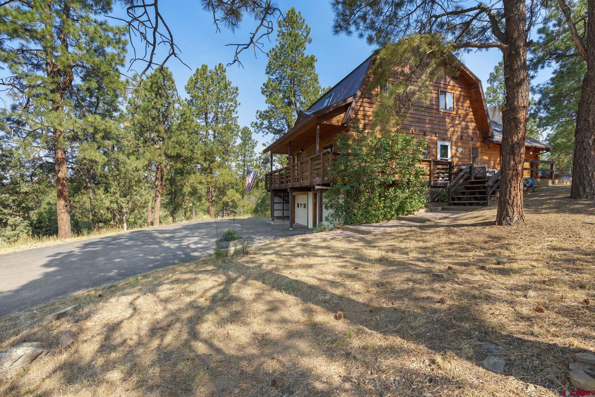 1310 Meadow Road Durango, CO 81303 - Photo 31 of 45 a view of a house with a yard