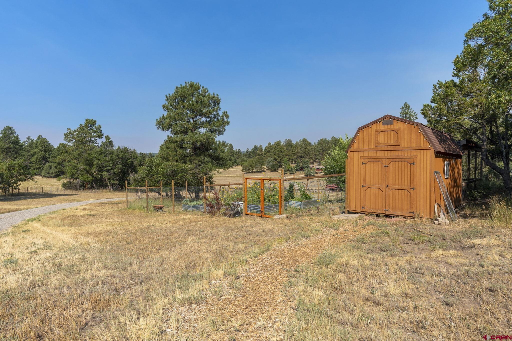 1310 Meadow Road Durango, CO 81303 - Photo 37 of 45 a backyard of a house with table and chairs