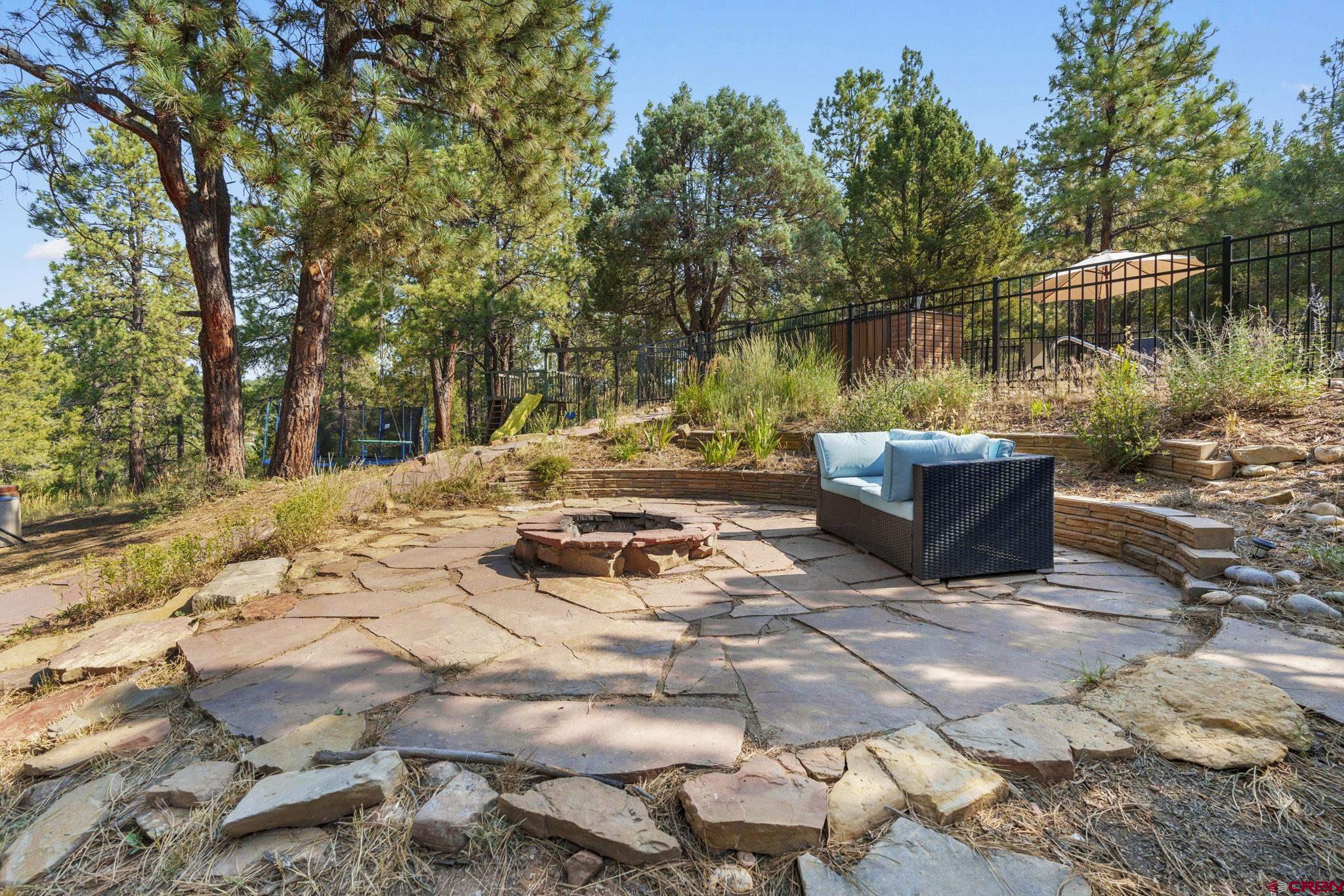 1310 Meadow Road Durango, CO 81303 - Photo 42 of 45 a view of backyard with seating space and trees