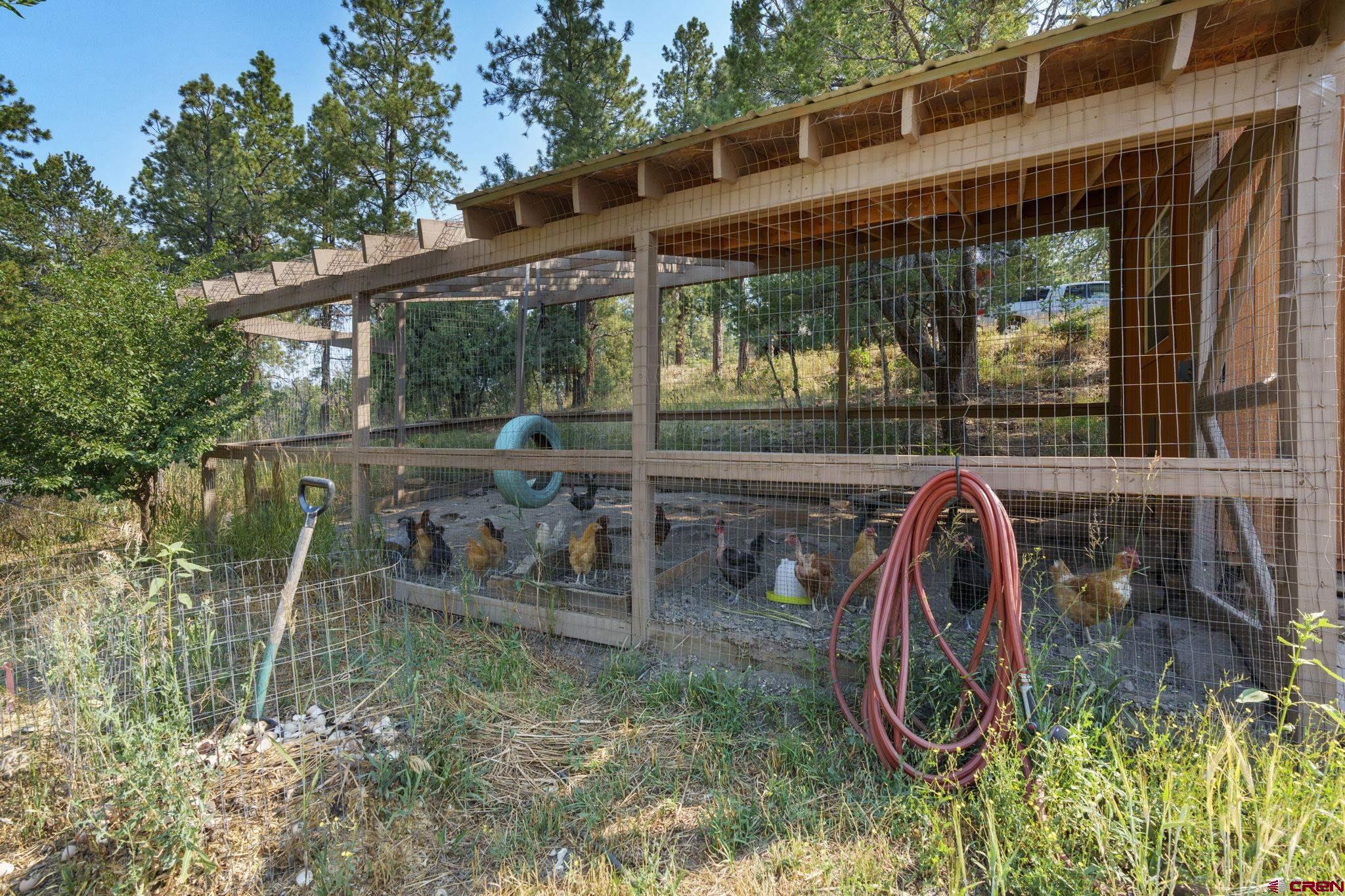 1310 Meadow Road Durango, CO 81303 - Photo 43 of 45 an outdoor view of a house with backyard and patio