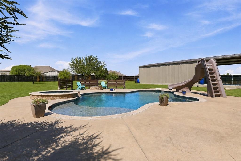 113 High Vista Road Decatur, TX 76234 - Photo 34 of 40 Grass is digitally enhanced. A Heated Gunite Saltwater Pool and Spa with all the Bells and Whistles! Lights, Sundeck, Slide and More!