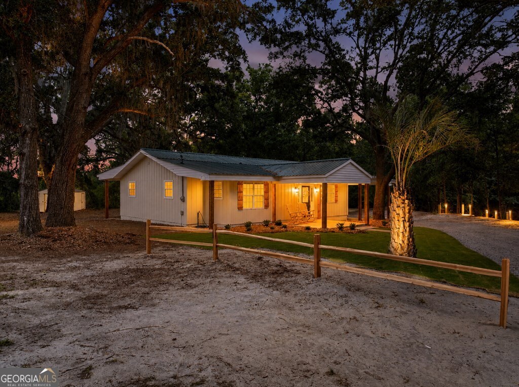 5781 Adams Road Valdosta, GA 31601 - Photo 6 of 27 a view of a house with a yard