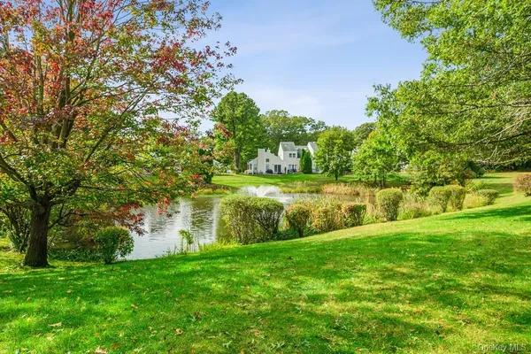a view of a lake with a big yard