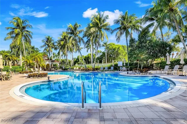 a view of a swimming pool with a patio