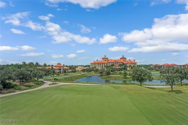 a view of swimming pool with outdoor seating and city view
