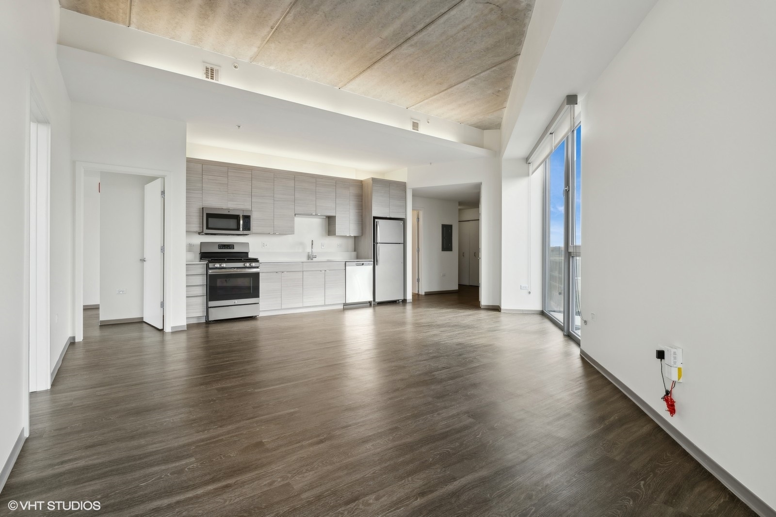 1920 North Milwaukee Avenue, Unit 407 Chicago, IL 60647 - Photo 7 of 19 a view of empty room with wooden floor