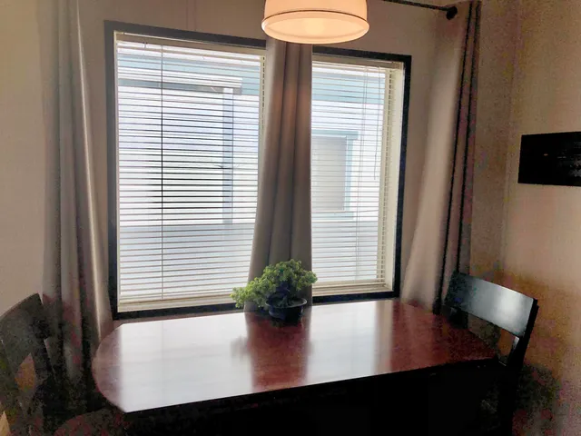 a view of a room with furniture and a window