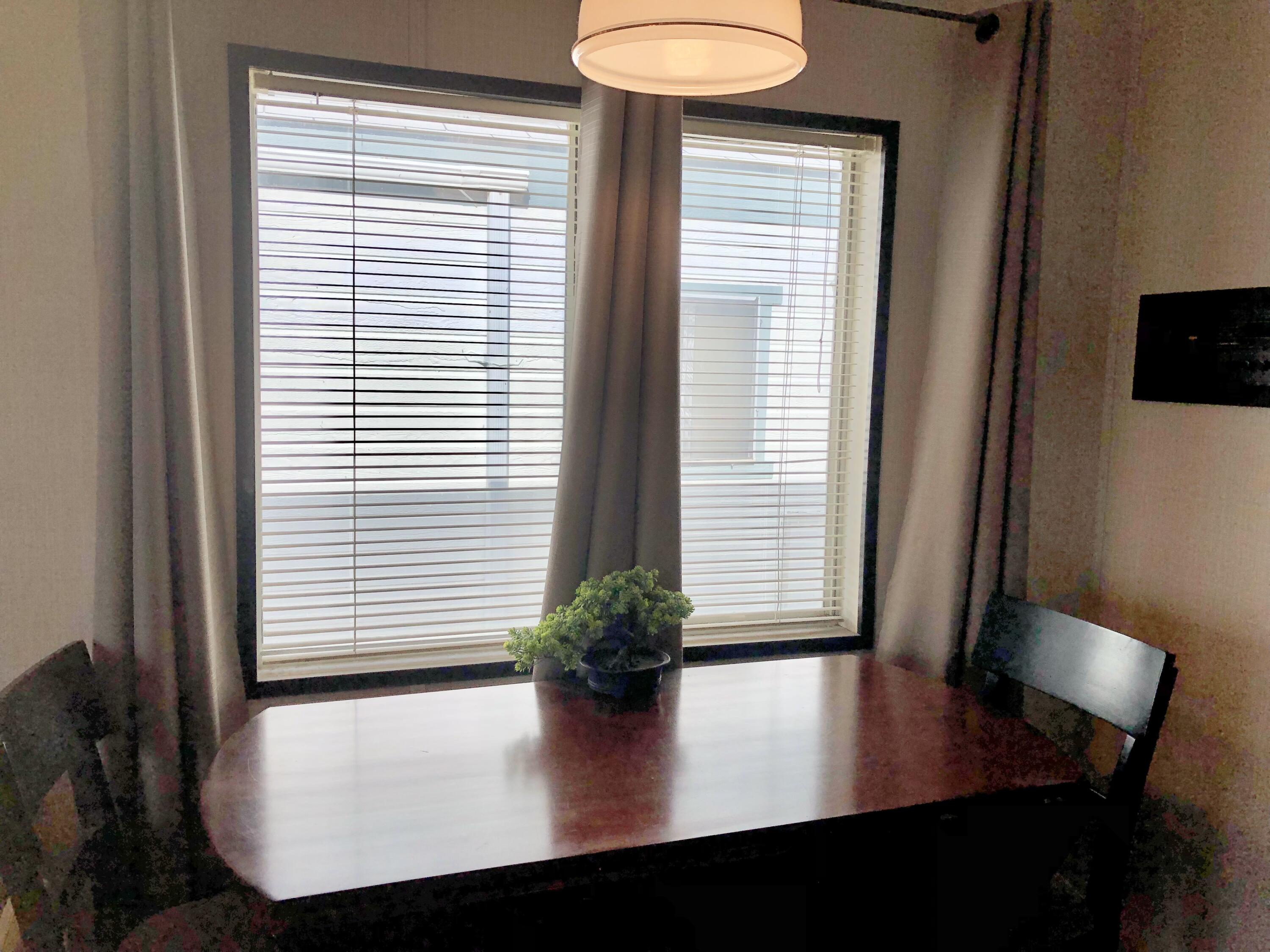 74711 Dillon Road Desert Hot Springs, CA 92241 - Photo 11 of 48 a view of a room with a window and wooden floor