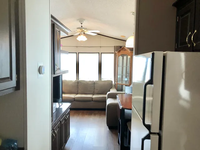 a bedroom with a bed and a mirror