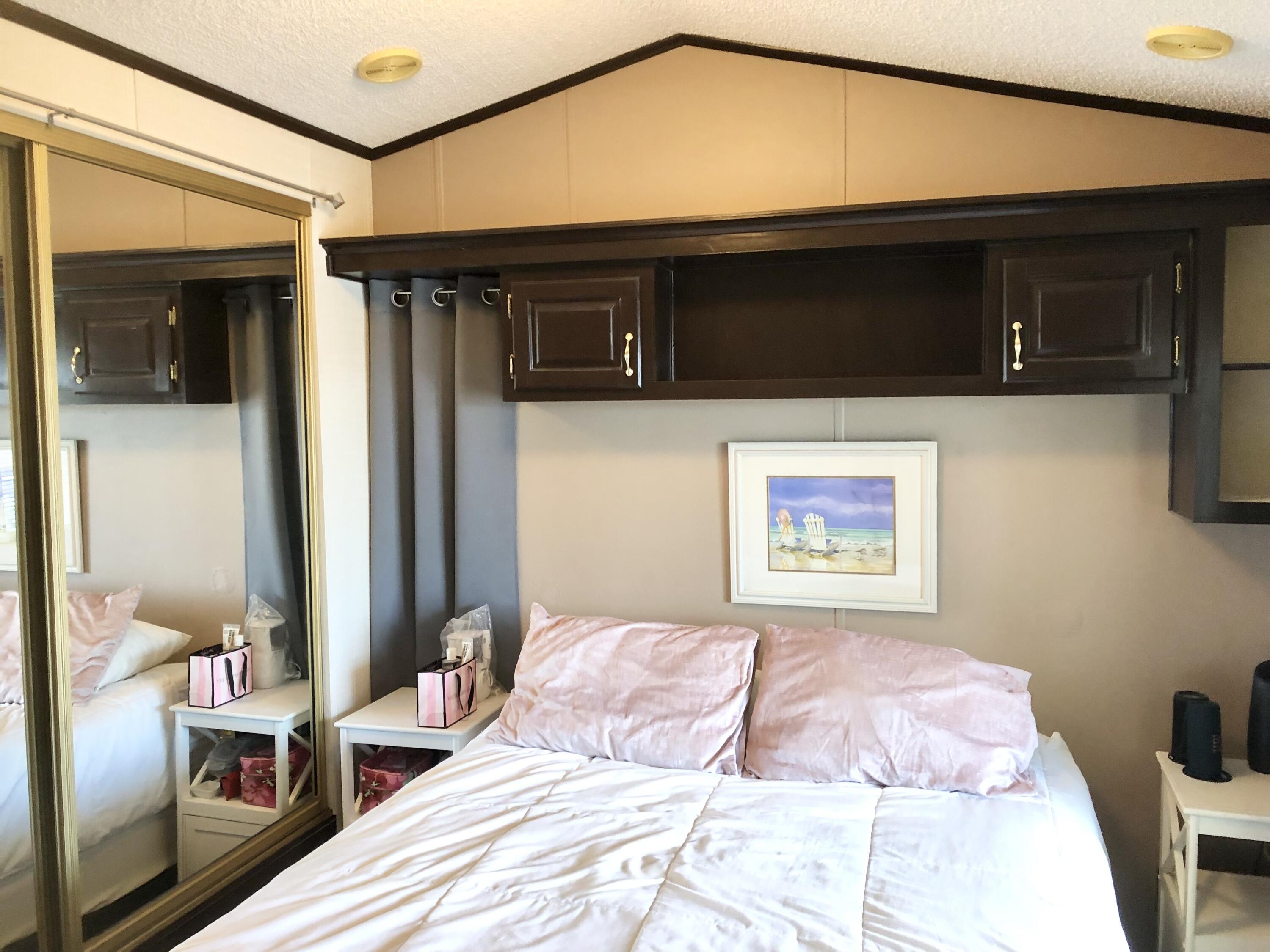 74711 Dillon Road Desert Hot Springs, CA 92241 - Photo 17 of 48 a bedroom with a bed and a television