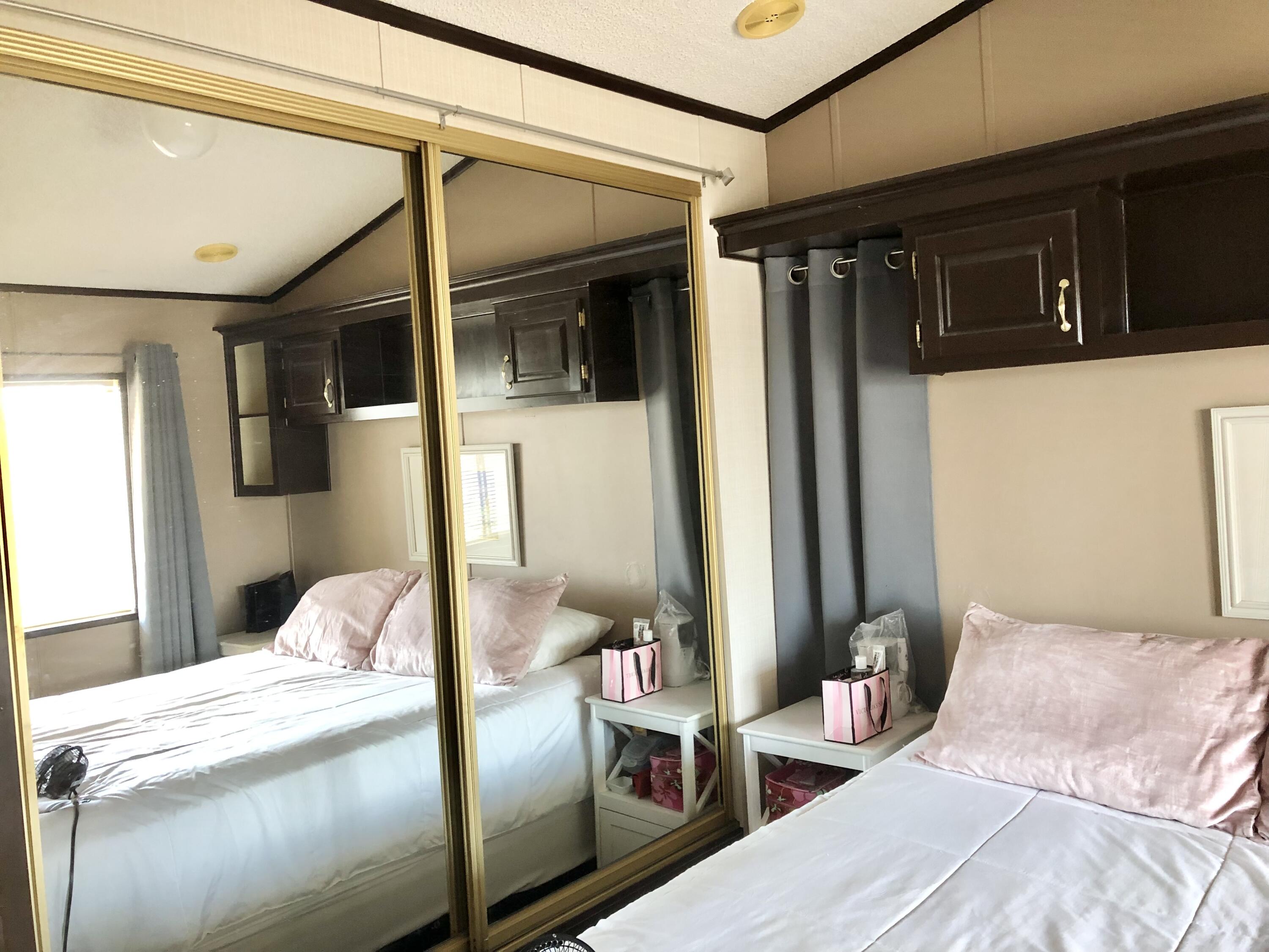 74711 Dillon Road Desert Hot Springs, CA 92241 - Photo 19 of 48 a bedroom with a bed with the view of bedroom