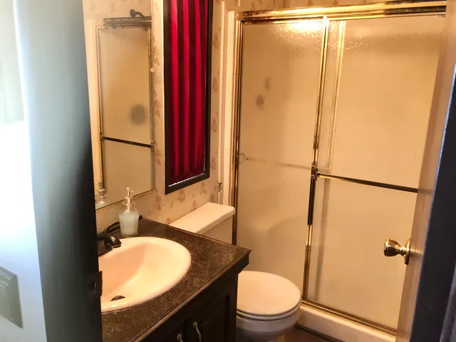 an aerial view of residential house with outdoor space and river