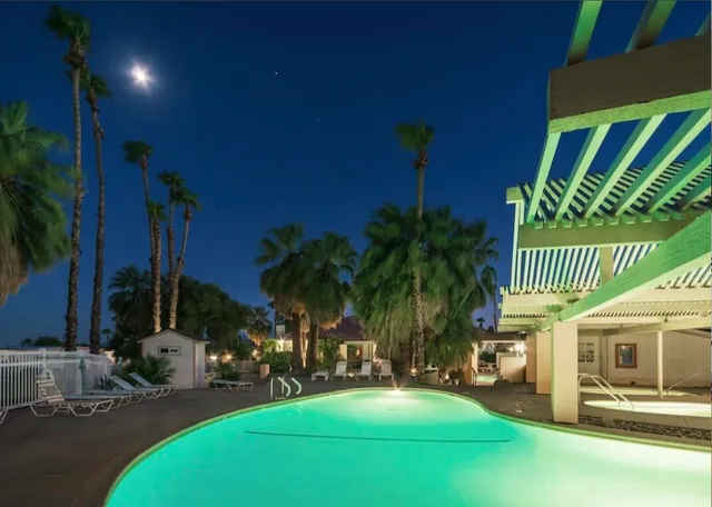 an outdoor sitting area with a table and chairs