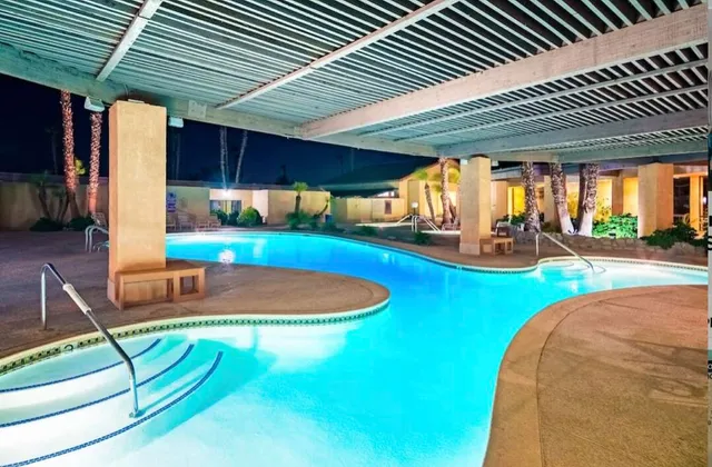 a view of a swimming pool with a lounge chairs