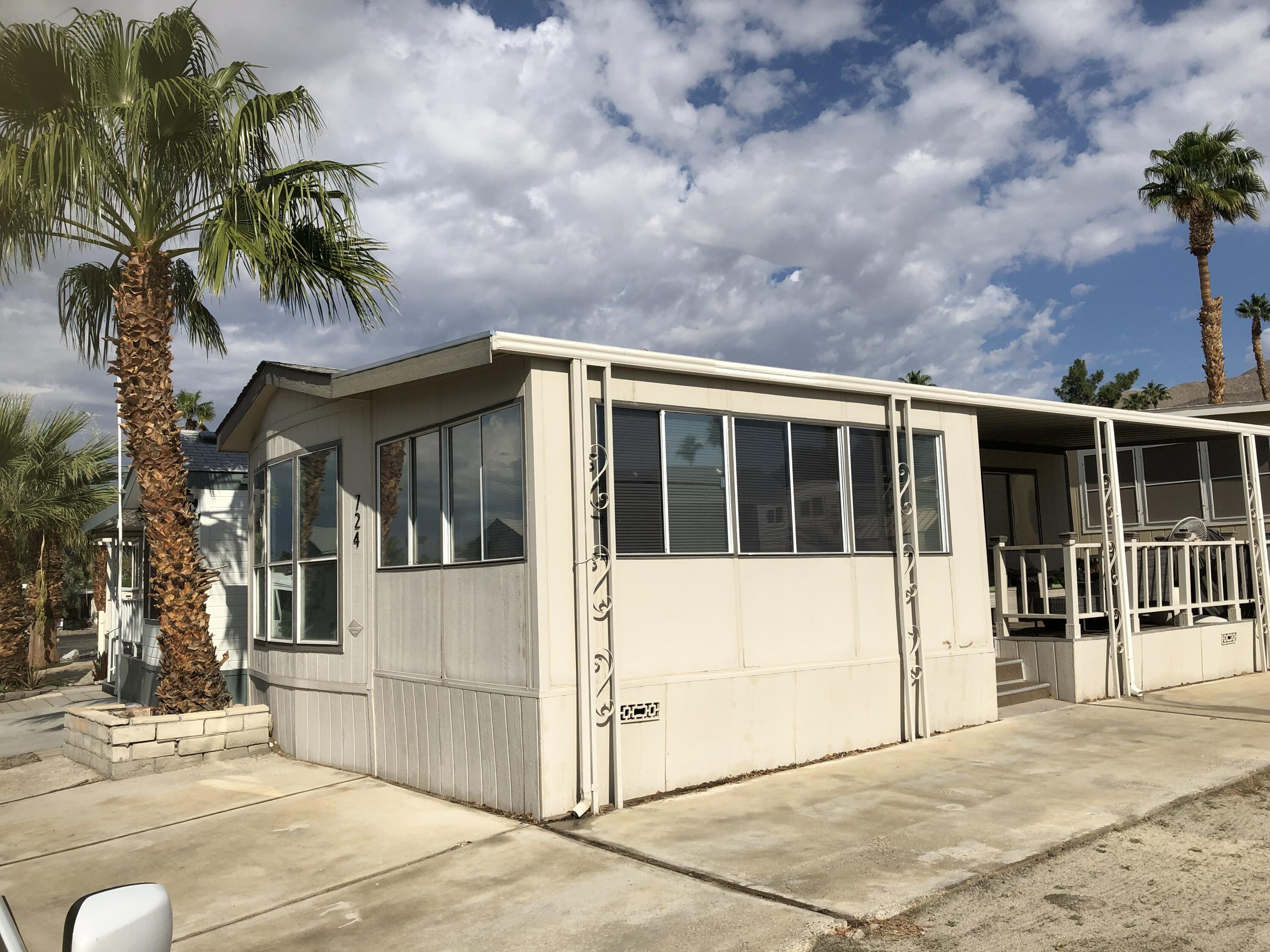 74711 Dillon Road Desert Hot Springs, CA 92241 - Photo 4 of 48 a view of a house with a backyard