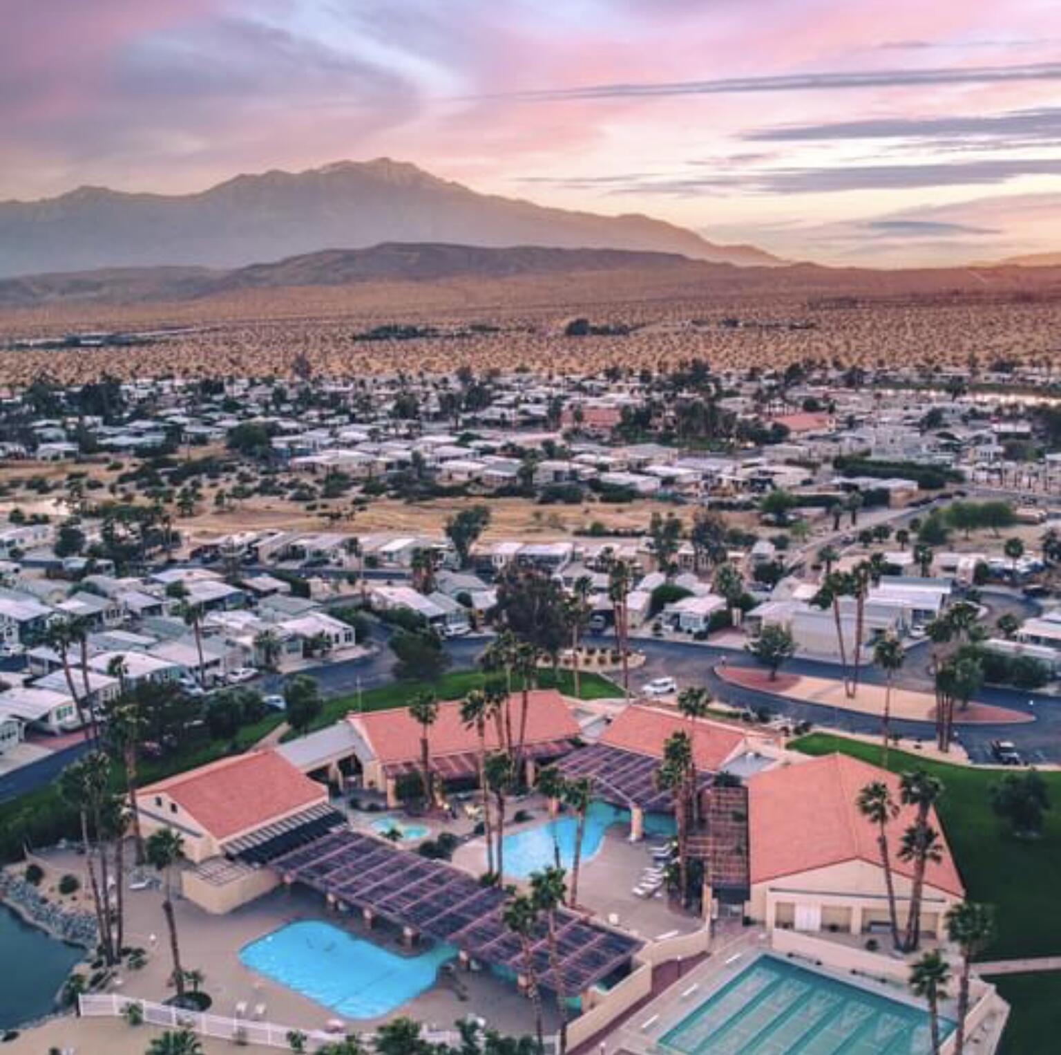 74711 Dillon Road Desert Hot Springs, CA 92241 - Photo 41 of 48 an aerial view of residential houses and outdoor space