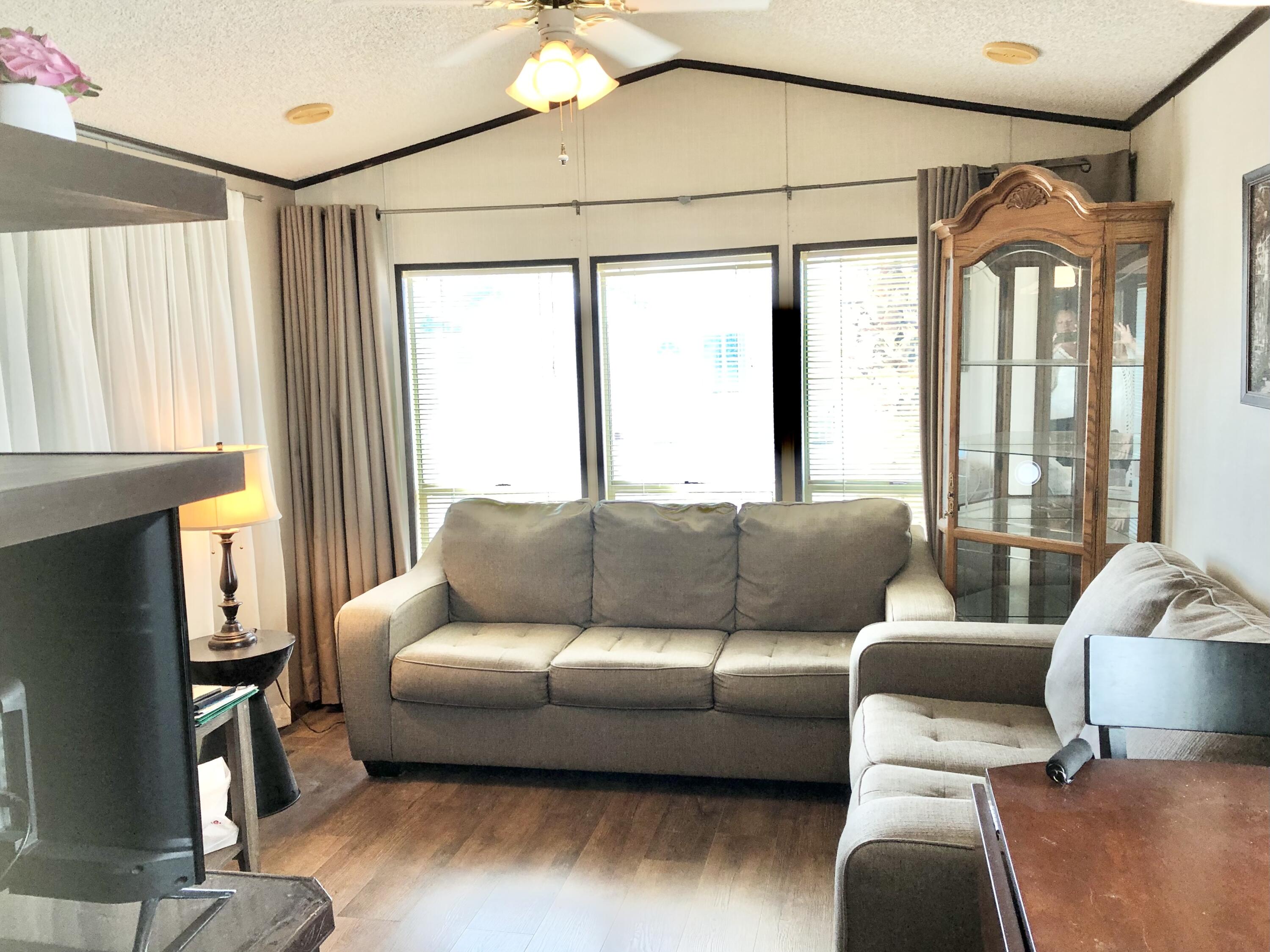 74711 Dillon Road Desert Hot Springs, CA 92241 - Photo 7 of 48 a living room with furniture and a large window