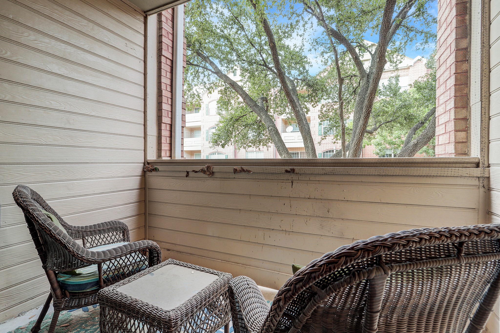 2111 Welch Street, Unit A129 Houston, TX 77019 - Photo 11 of 15 a view of a chair and table in the balcony