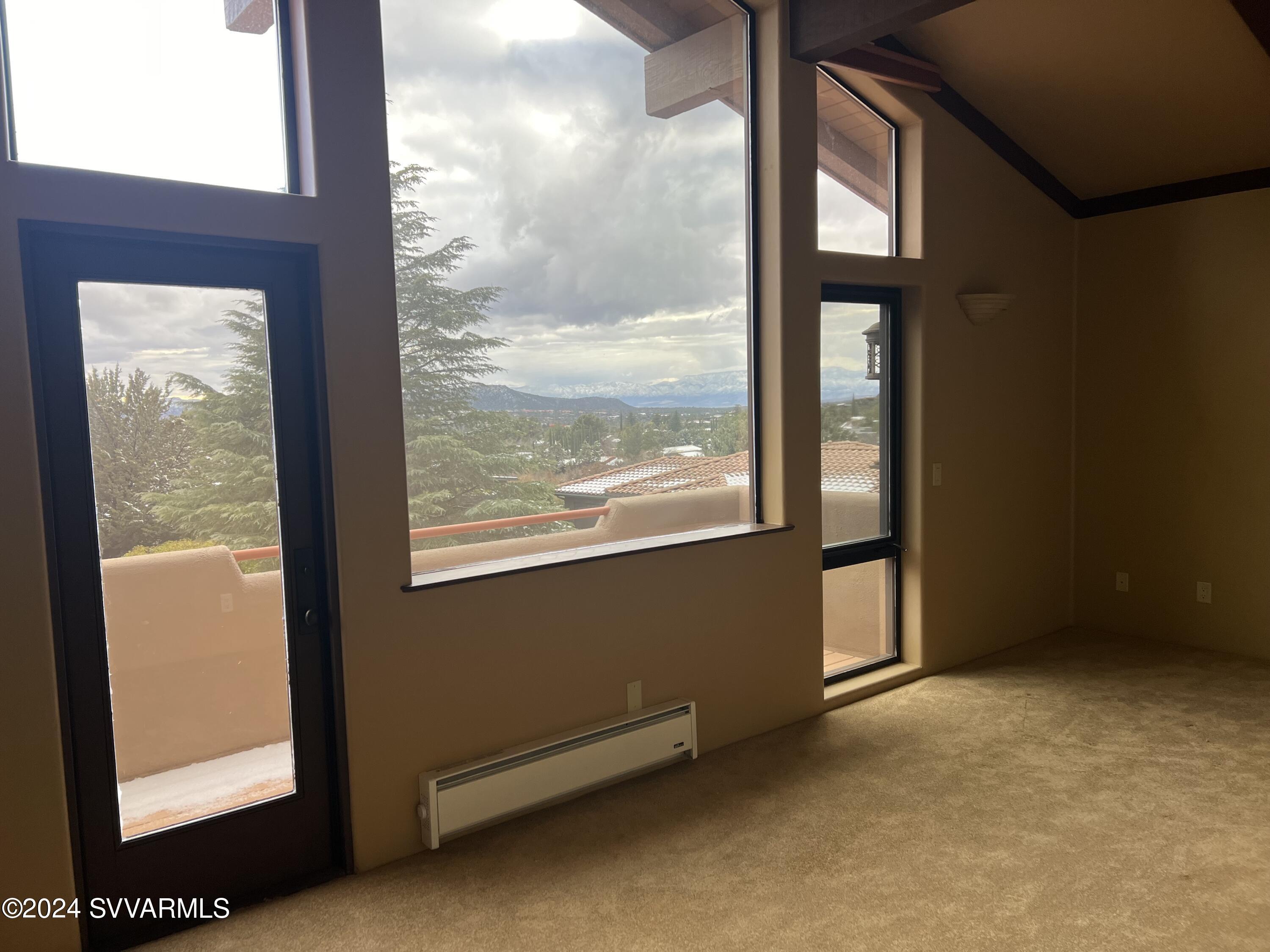 985 Rodeo Road Sedona, AZ 86336 - Photo 10 of 12 a view of an empty room and window