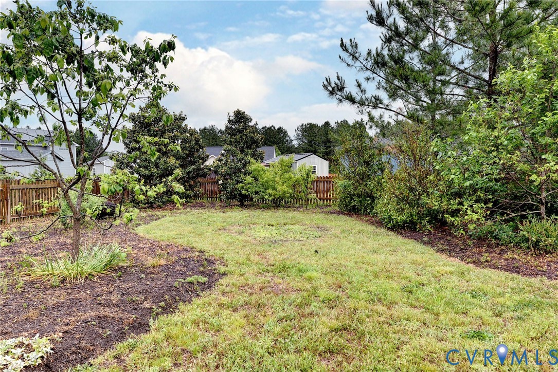 8904 Rock Cedar Road New Kent, VA 23124 - Photo 30 of 37 a view of a yard with plants and large trees