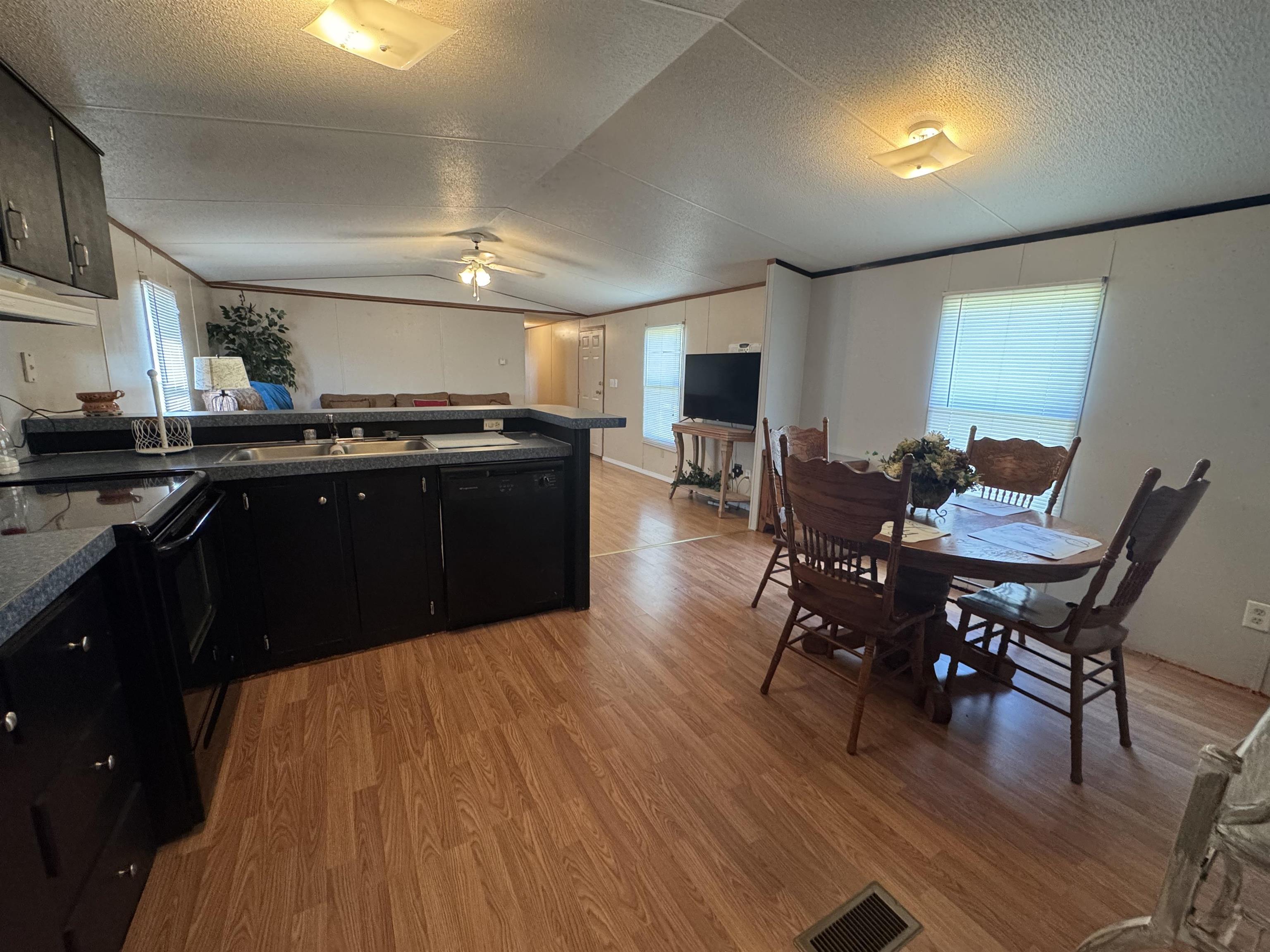 2511 Watkins Road Michie, TN 38357 - Photo 14 of 40 Open-concept living area with wood-finish flooring