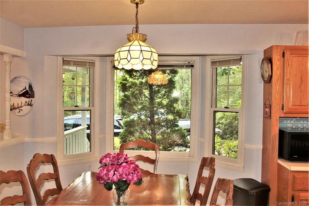 185 Davis Creek Road Murphy, NC 28906 - Photo 12 of 48 a view of a dining room with furniture window and outside view