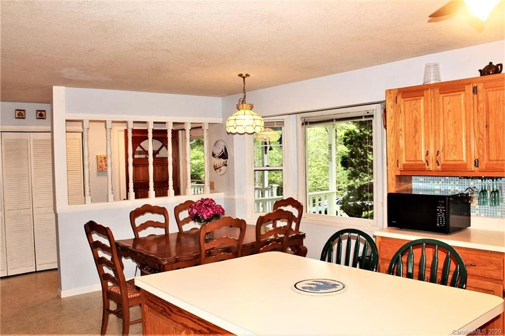 185 Davis Creek Road Murphy, NC 28906 - Photo 13 of 48 a view of a dining room with furniture window and outside view