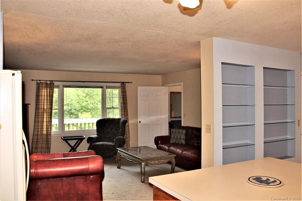 185 Davis Creek Road Murphy, NC 28906 - Photo 16 of 48 a living room with furniture and a window
