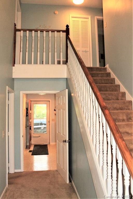 185 Davis Creek Road Murphy, NC 28906 - Photo 19 of 48 a view of staircase with wooden floor and a rug